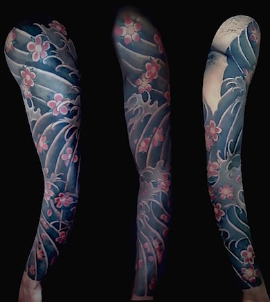 Calypso-Tattoo - Gallery - Japanese style tattoo sakura flowers and waves